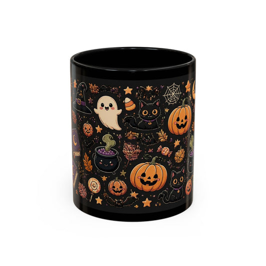 A black ceramic mug decorated with a Halloween-themed pattern featuring orange pumpkins, a white ghost, a black cat, a cauldron, and gold stars on a black background.