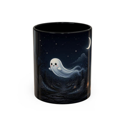 A black ceramic mug featuring a printed illustration of a cute, smiling white ghost floating over a dark forest under a starry night sky with a crescent moon.