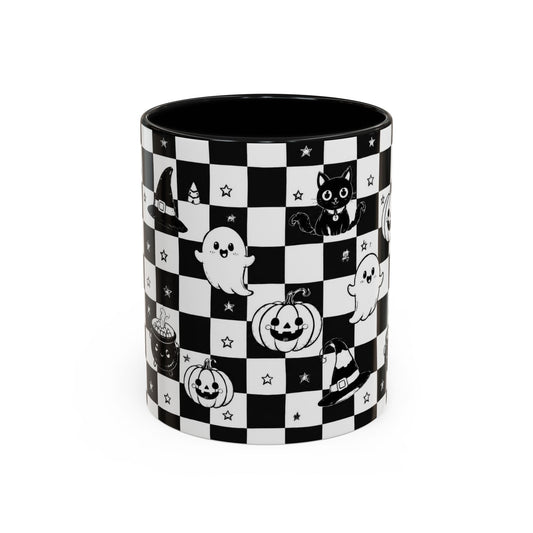 A cylindrical ceramic mug with a black and white checkerboard pattern decorated with cute Halloween illustrations, including ghosts, pumpkins, a cat, a witch hat, and stars. The mug is shown on a clean white background.