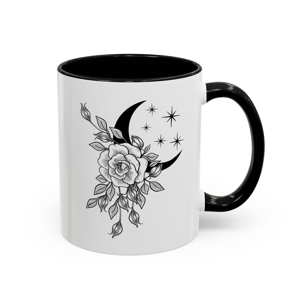 A white ceramic mug with a black interior, black handle, and a black and gray line art design of a crescent moon, flowers, and stars on the side, shown on a plain white background.