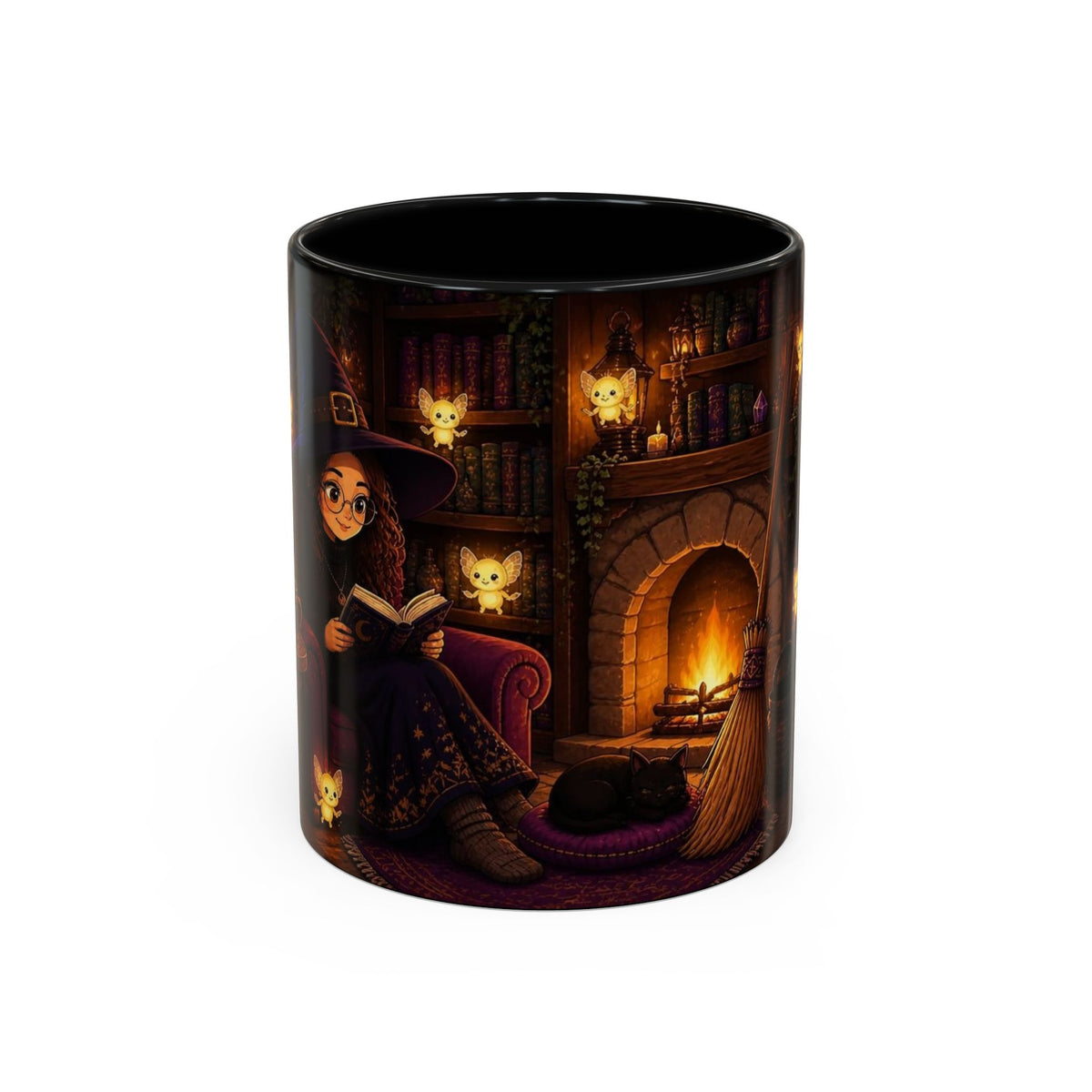 A black ceramic mug featuring a detailed illustration of a witch reading by a cozy fireplace with cats and a broomstick, shown on a plain white background.