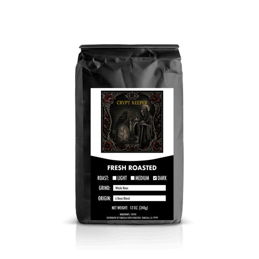 A 12 oz black coffee bag from Casa Del Arenal, featuring a white and black label with text indicating 'Fresh Roasted' and 'Columbia Coffee'.